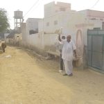 A farmer plying cotton for a bed.